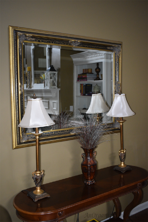 old mirror and table that was used in foyer