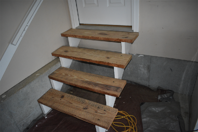 Paint stair risers white  to update your garage entryway.