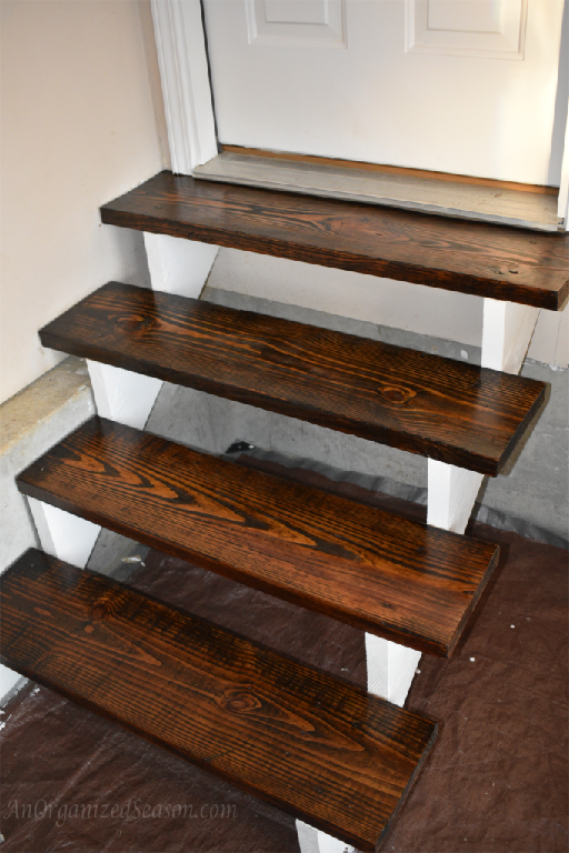 Beautifully refinished steps for a new fresh look. AnOrganizedSeason.com