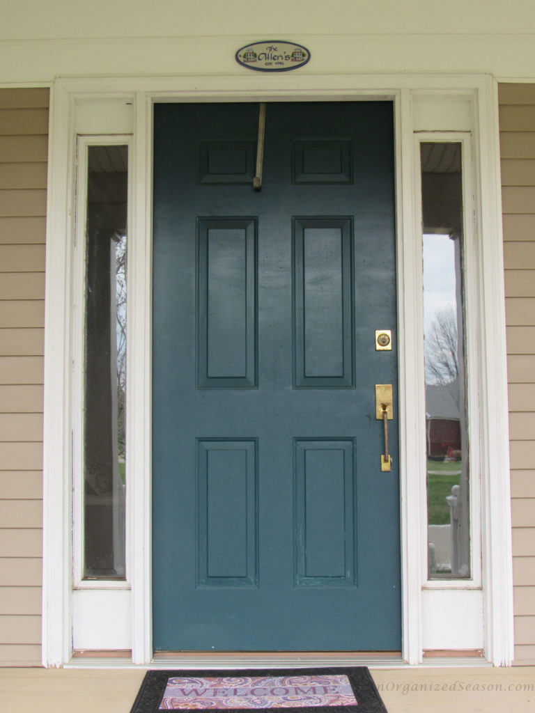 old front door and hardware, in need of painting