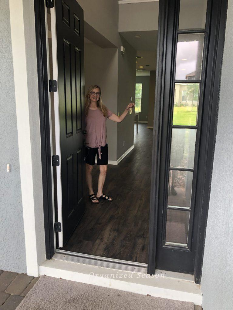 Donna entering the new house for the first time.