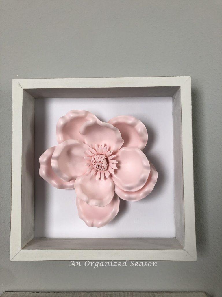 Used the reverse canvas technique to make a white frame with pink flower inside.