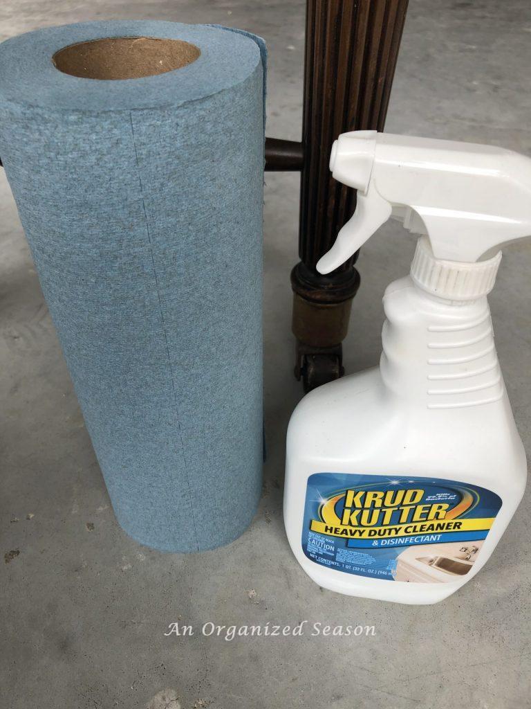 Product and towels used to clean the legs and base of the desk,