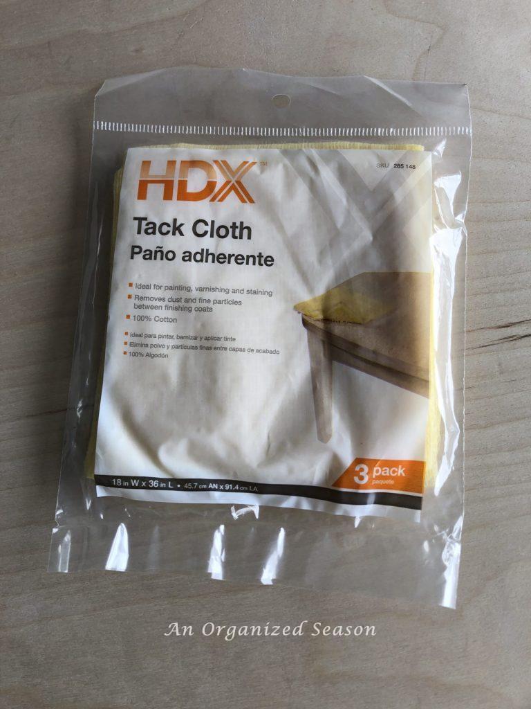 Tack clothe used to remove dust particles.