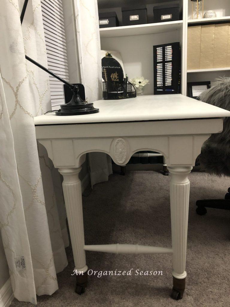 A desk that my husband built from my Grandmothers piano and that I painted white to match the room. 