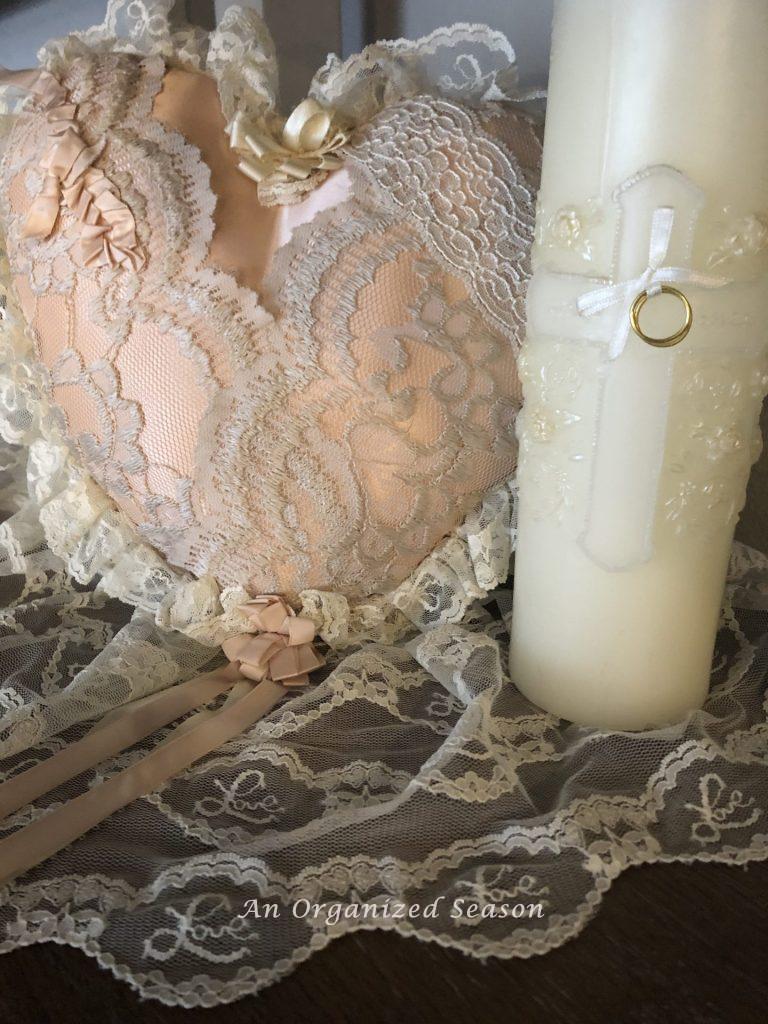 Unity candle and heart-shaped pillow ring bearer carried in our wedding.