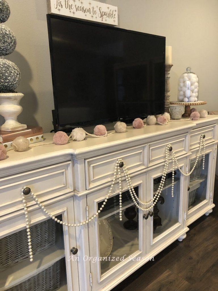 TV console decorated for Valentines day.