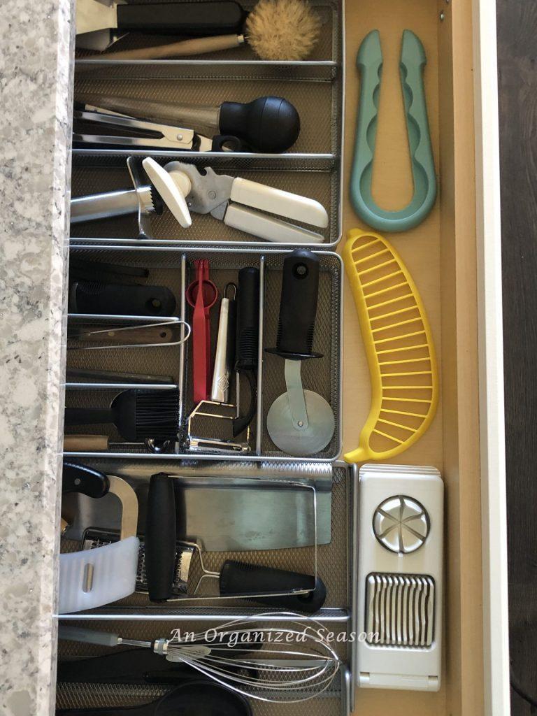 Organized drawer with items used for chopping and cutting.