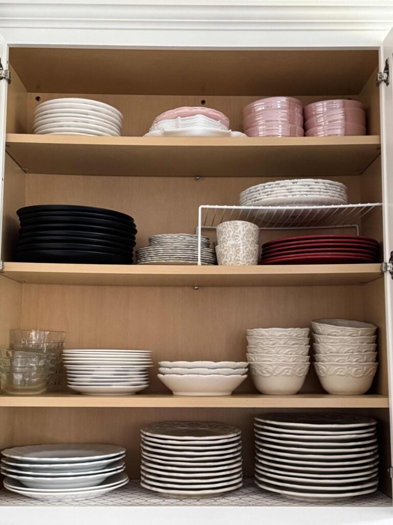 kitchen cabinet with organized plates and bowls