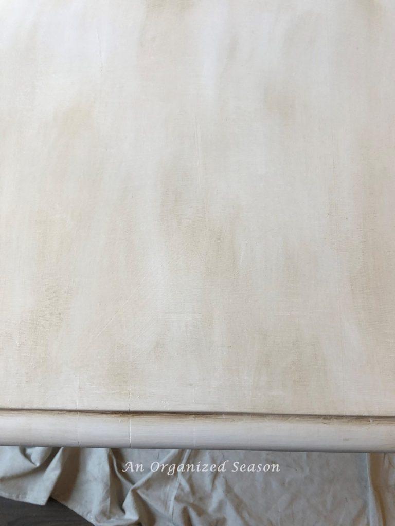 White table after being waxed with brown wax. 