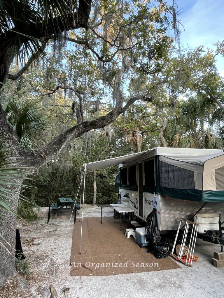 A pop up camper set up on site # 158 ready for camping at the beautiful Fort De Soto campground.