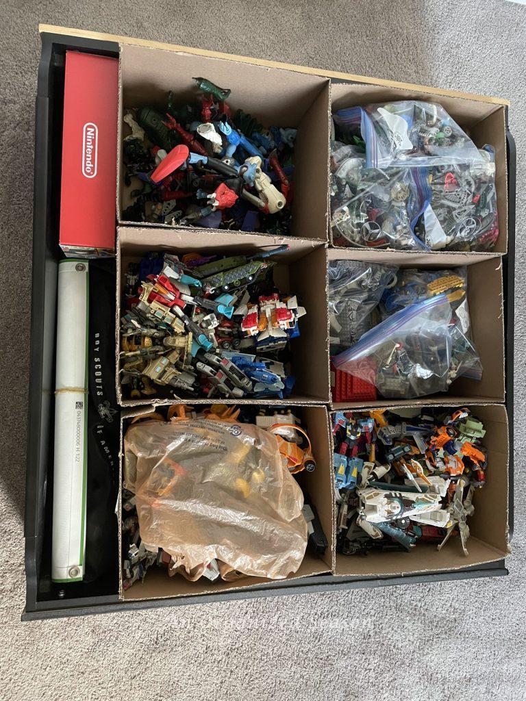 Transformer toys stored inside a large drawer. 