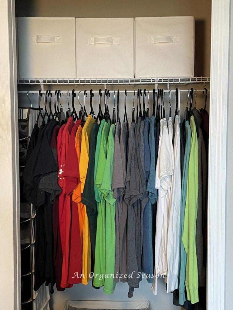 To organize a kid's bedroom closet, hang all of the shirts together. 