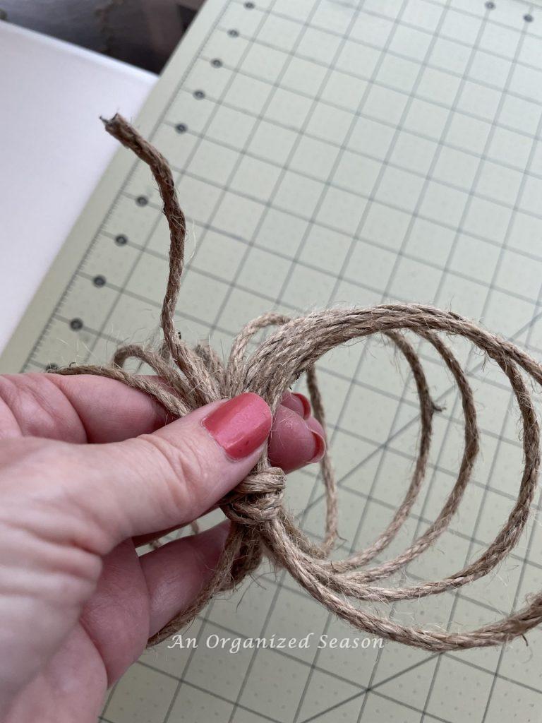 Securing wired jute cord showing how to make two types of twine pumpkins.