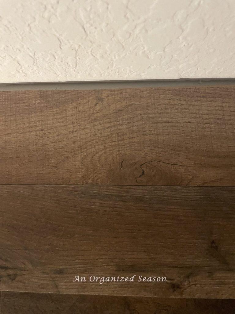 Close of small gap at top of feature wall
