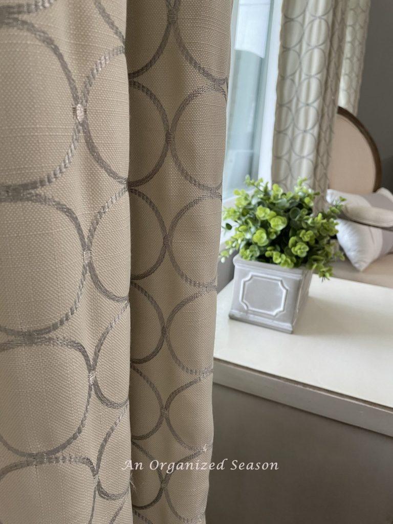 Step one to achieve a master bedroom makeover is to address the window treatments.