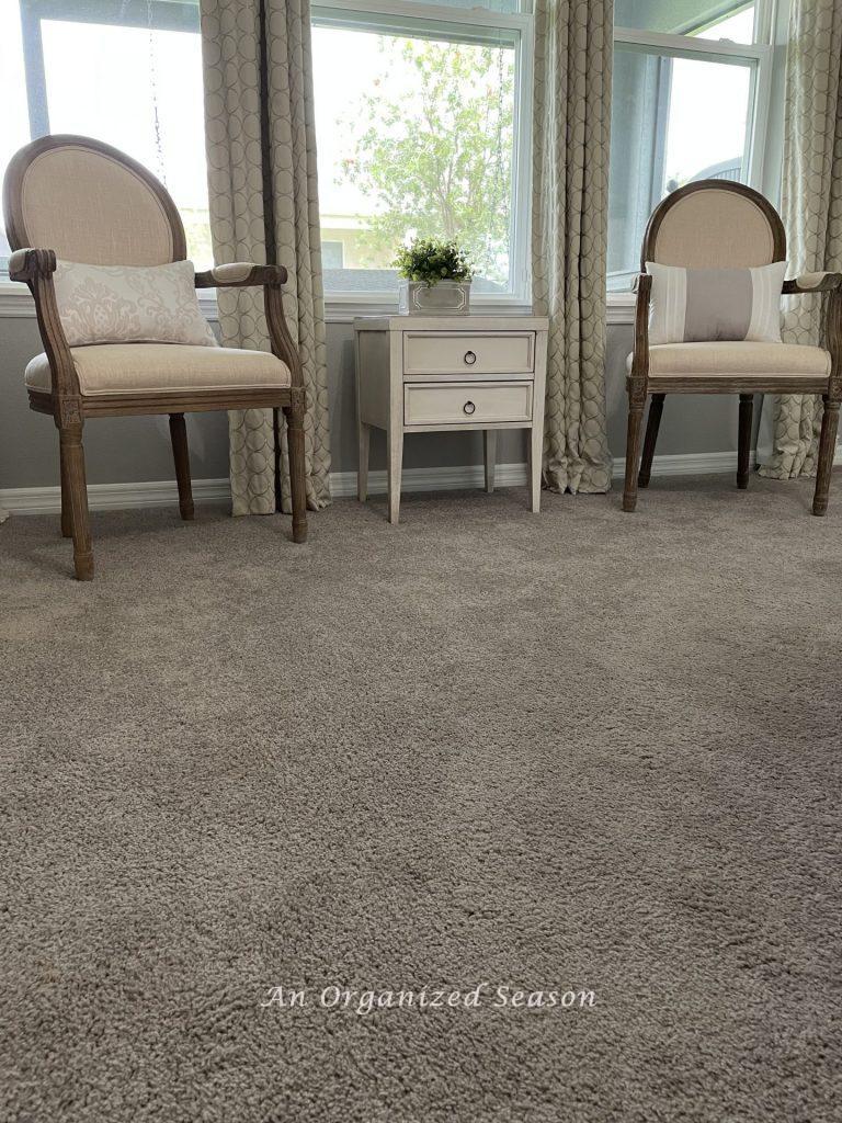 Step four to achieve a master bedroom makeover is to address the gray carpeting.