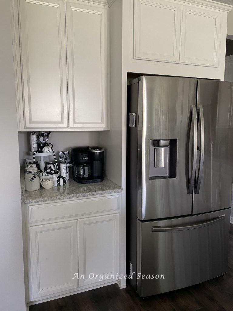 Coffee bar set-up on a kitchen counter showing steps to make a fall coffee bar.