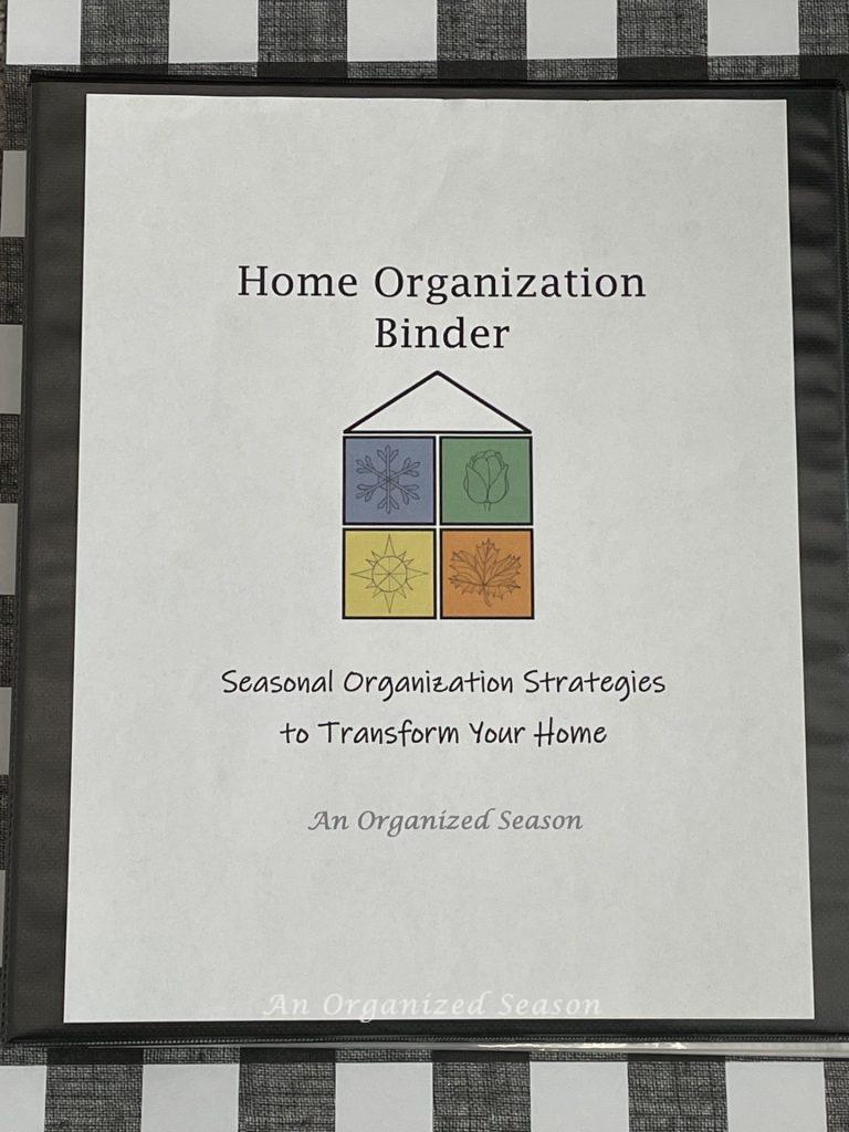 A black binder with a cover sheet that says "Home Organization Binder", "Seasonal Strategies to Transform Your Home". Step one for how to set Fall home organization goals.  
