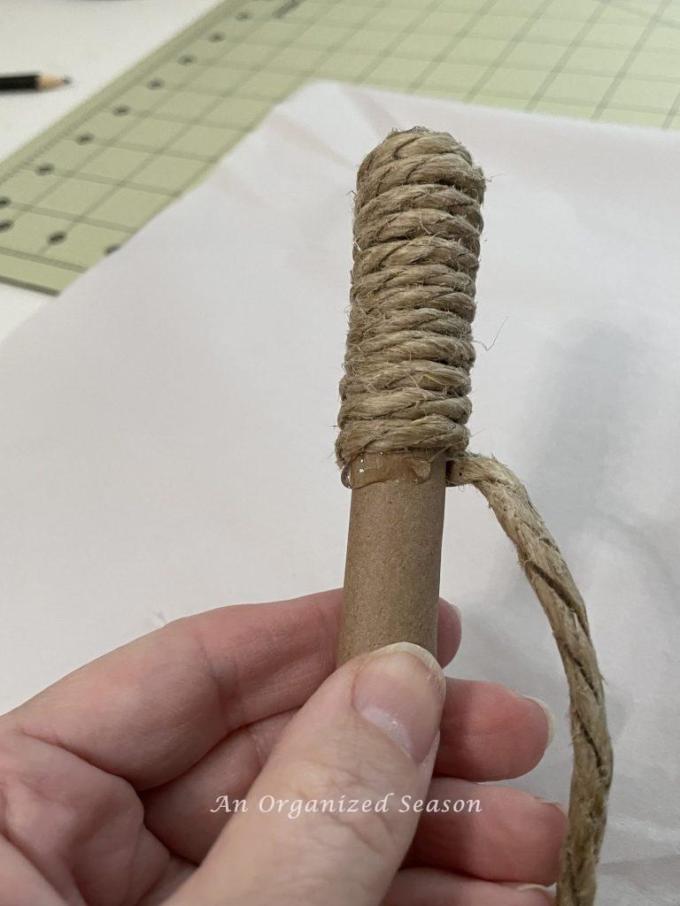 Twine that has been wrapped around a paper roll to make a stem for adorable yarn pumpkins. 