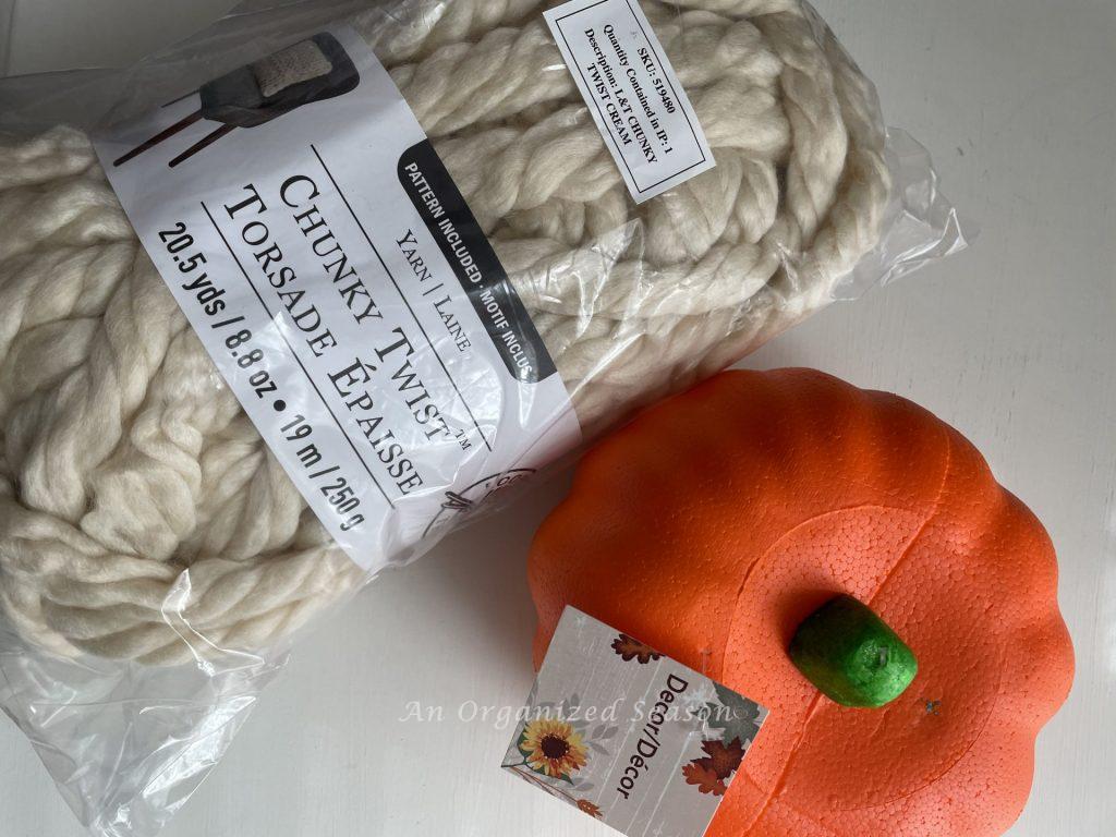 A bag of chunky twist yarn and a foam faux pumpkin. Two items needed to make adorable yarn pumpkins! 