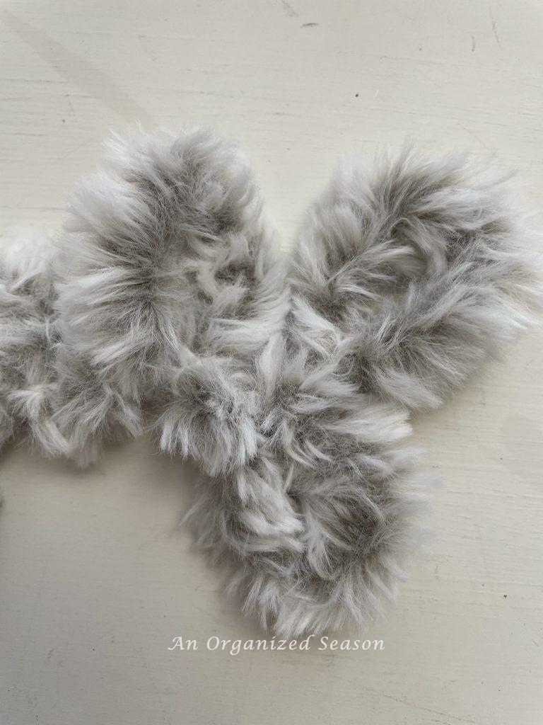 Faux fur looped yarn that will be used to make a DIY cone Christmas tree. 