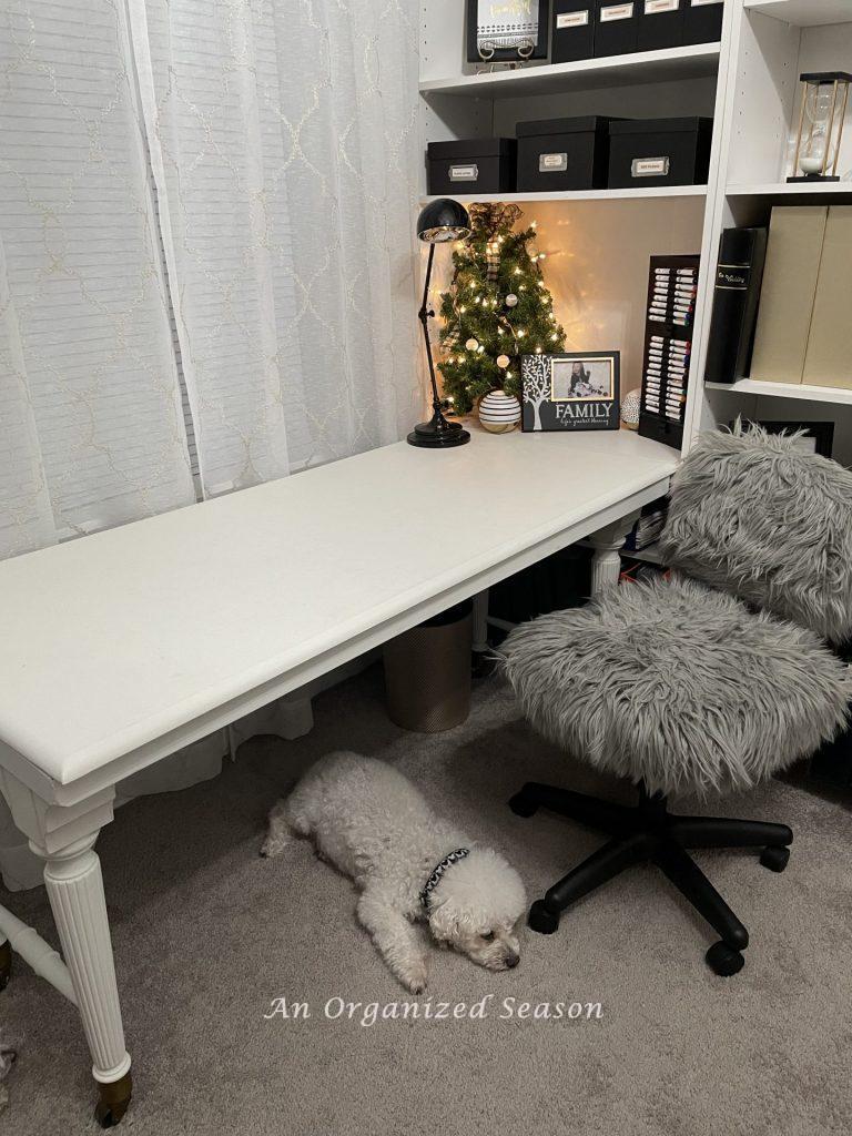 An empty white desk that would make a perfect gift wrapping station!
