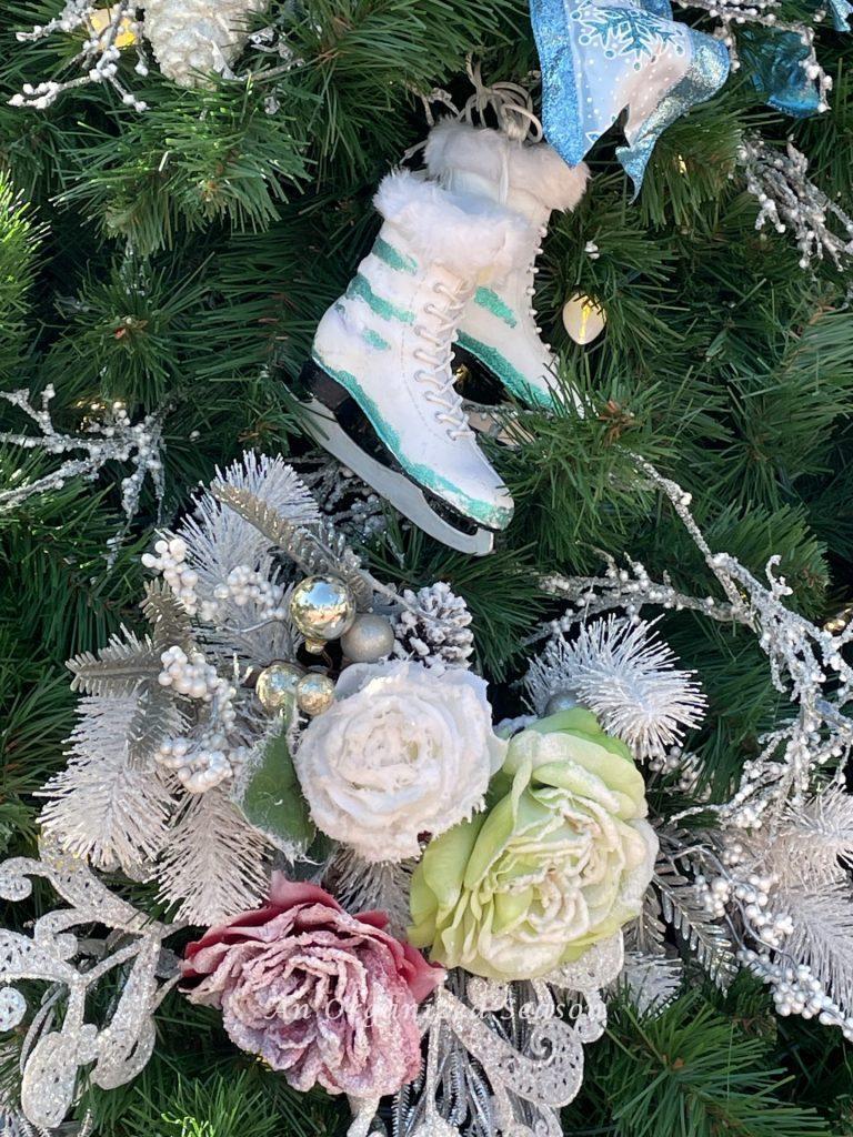 Ice skates and beautiful roses on the Frozen tree of the Christmas tree stroll.