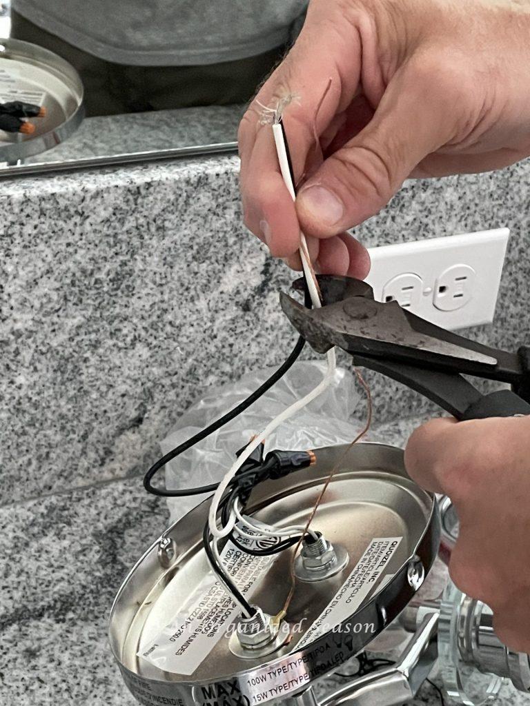 How to cut the wires when you replace a bathroom light fixture. 