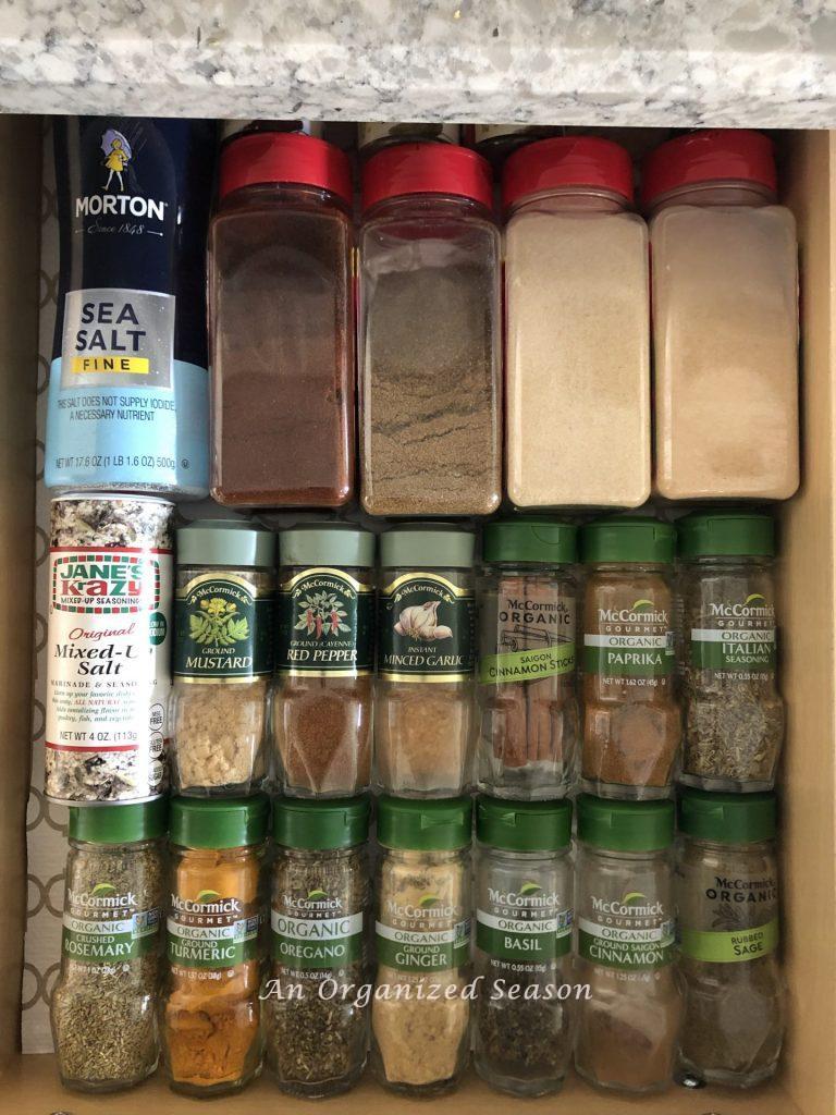 A kitchen drawer showing how to organize spices.