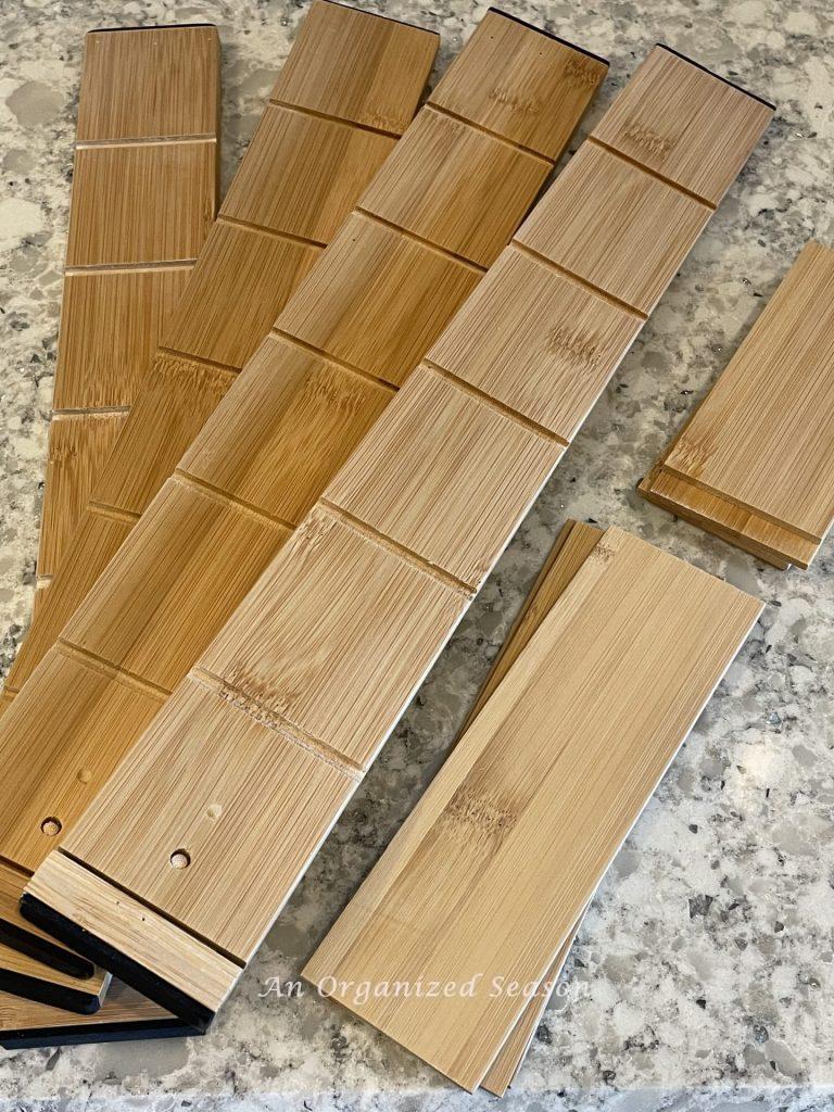 Bamboo dividers you can use to organize a kitchen drawer. 