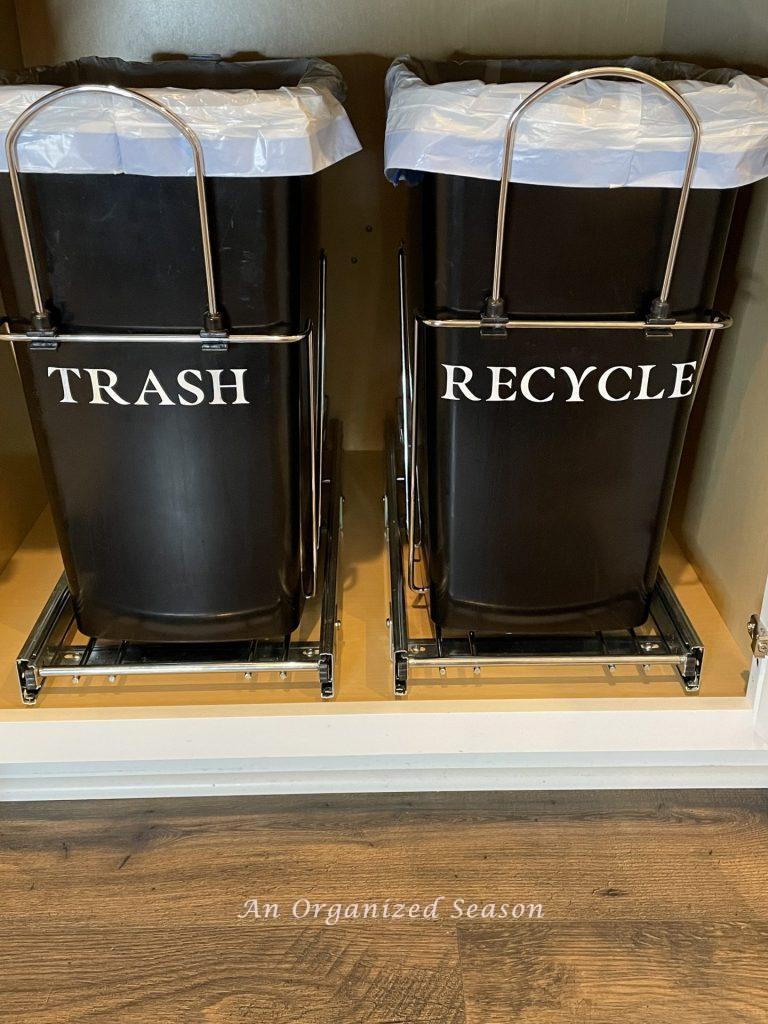 Installing pull-out trash and recycle cans is a  helpful kitchen cabinet organization solution!