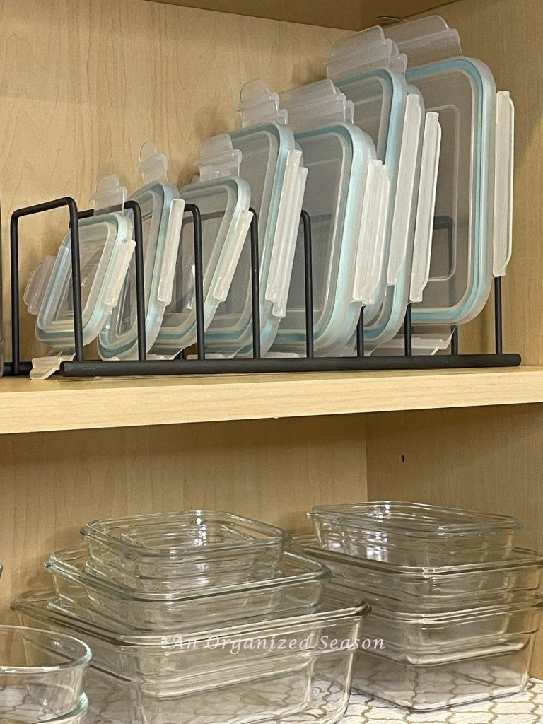  A black metal lid organizer is a helpful kitchen cabinet organization solutions!