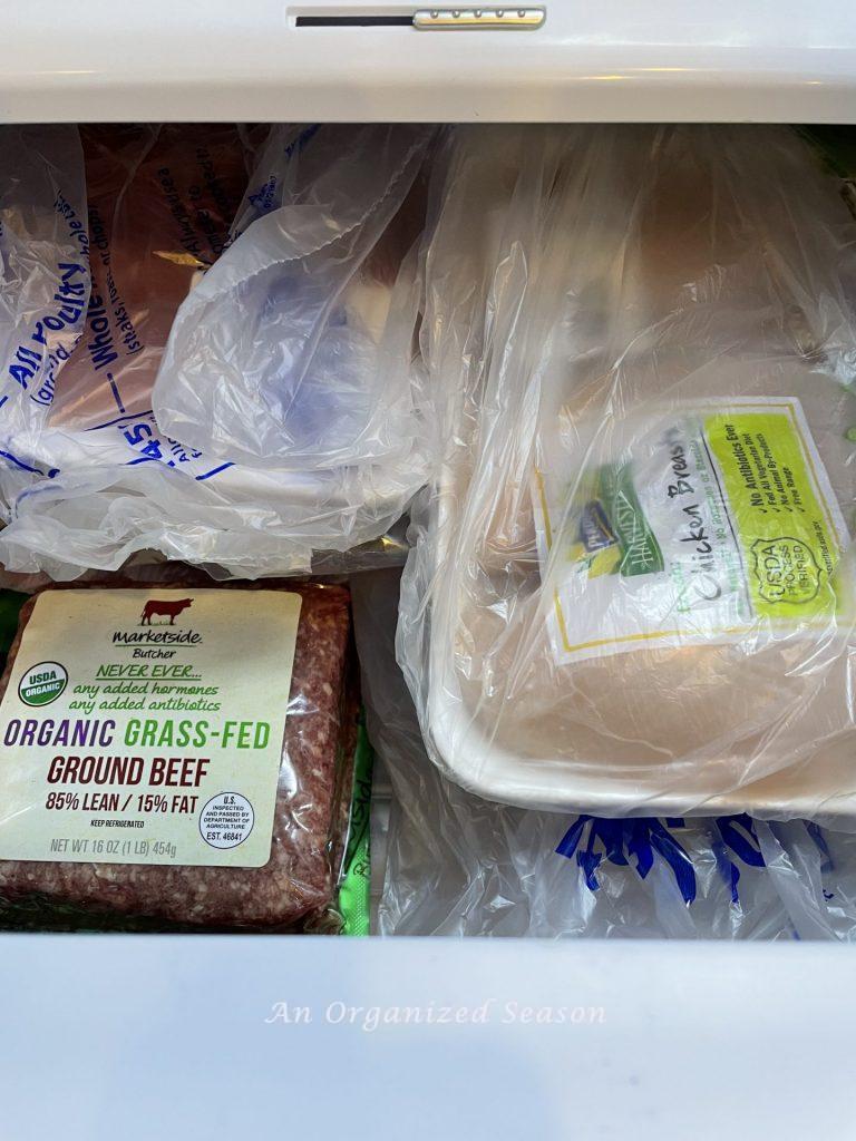 Organize meat inside the meat drawer of your refrigerator. 