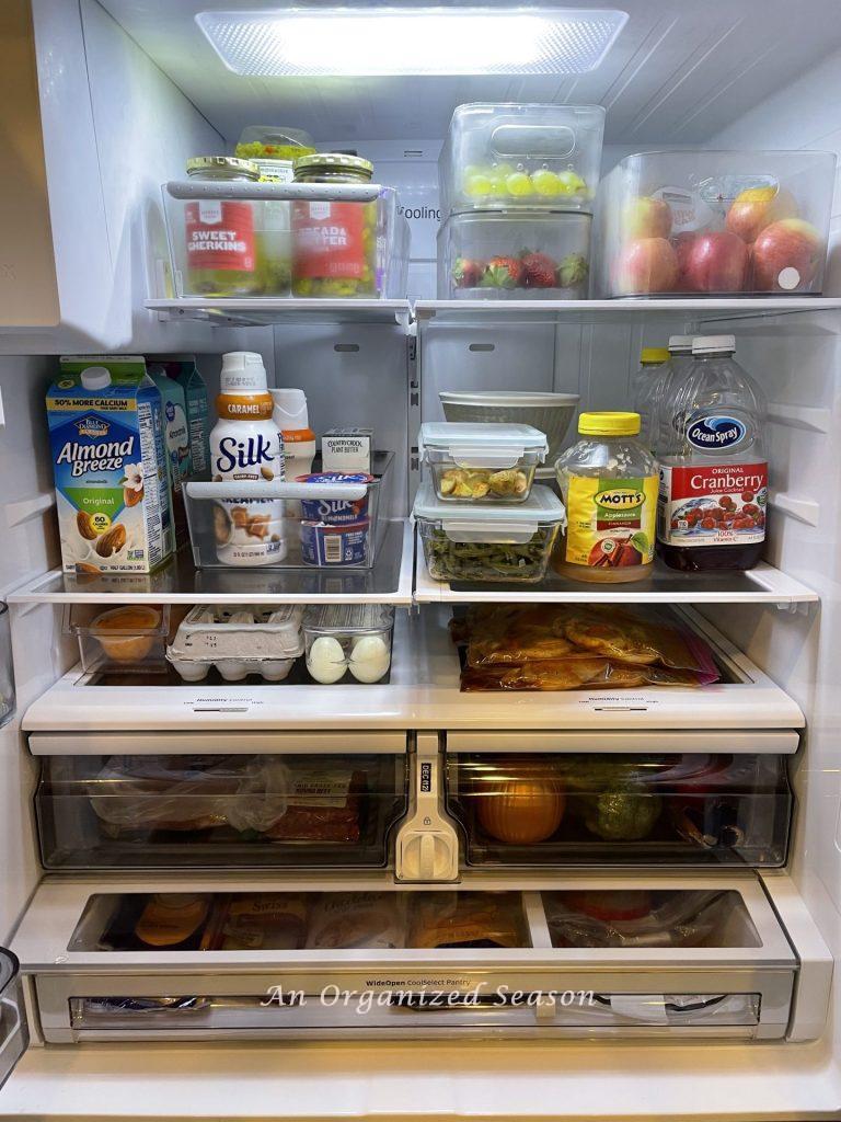 The inside of a french door refrigerator showing an example of how to organize it.