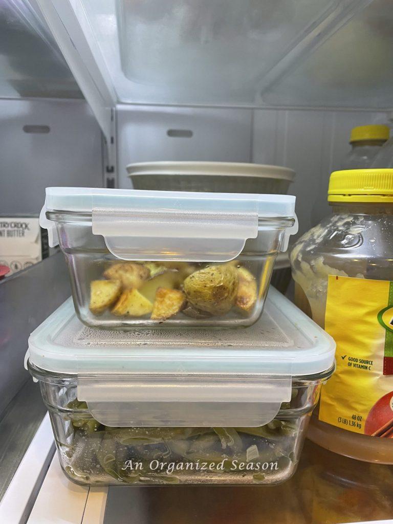 Organize leftovers in clear stackable containers inside the refrigerator. 