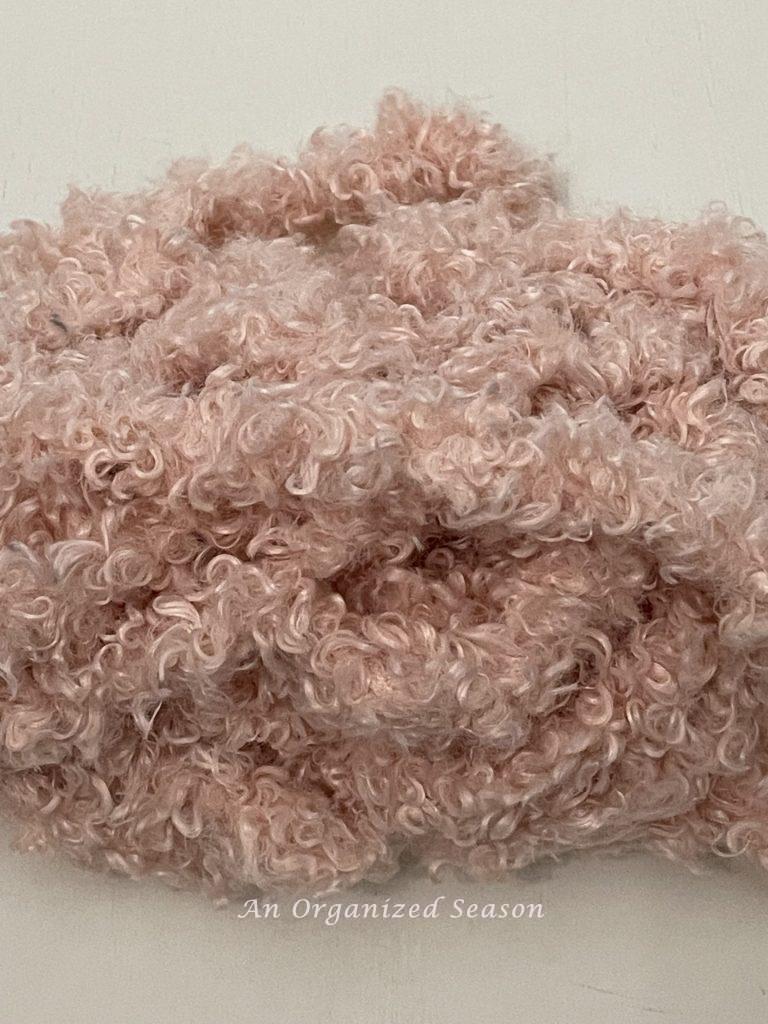 Blush colored Teddy Bear yarn used to craft a Valentine's wreath.