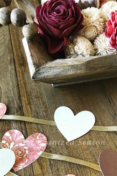 Craft a paper heart and ribbon garland for Valentine's Day