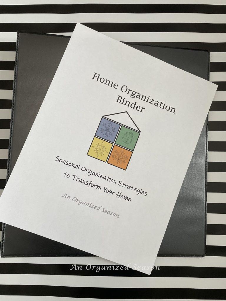 A binder with a cover sheet called "Home Organization Binder" to use during the  Spring Home Organization & Improvement Challenge.