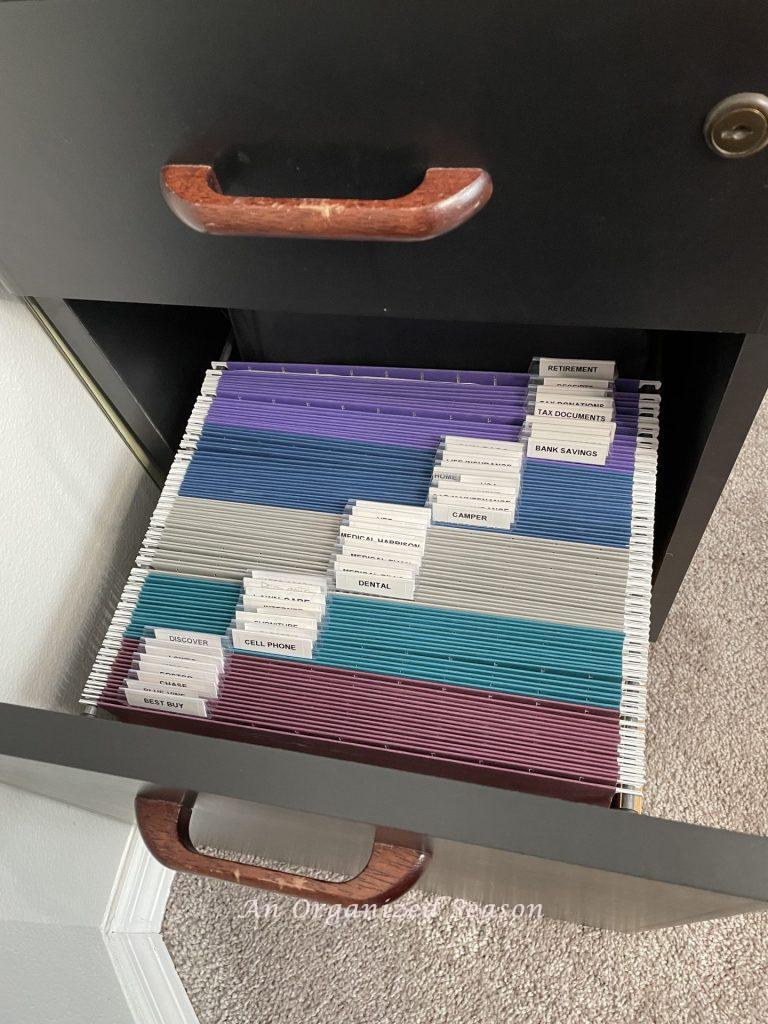 Organized files in a cabinet, an example of how to get rid of paper clutter.