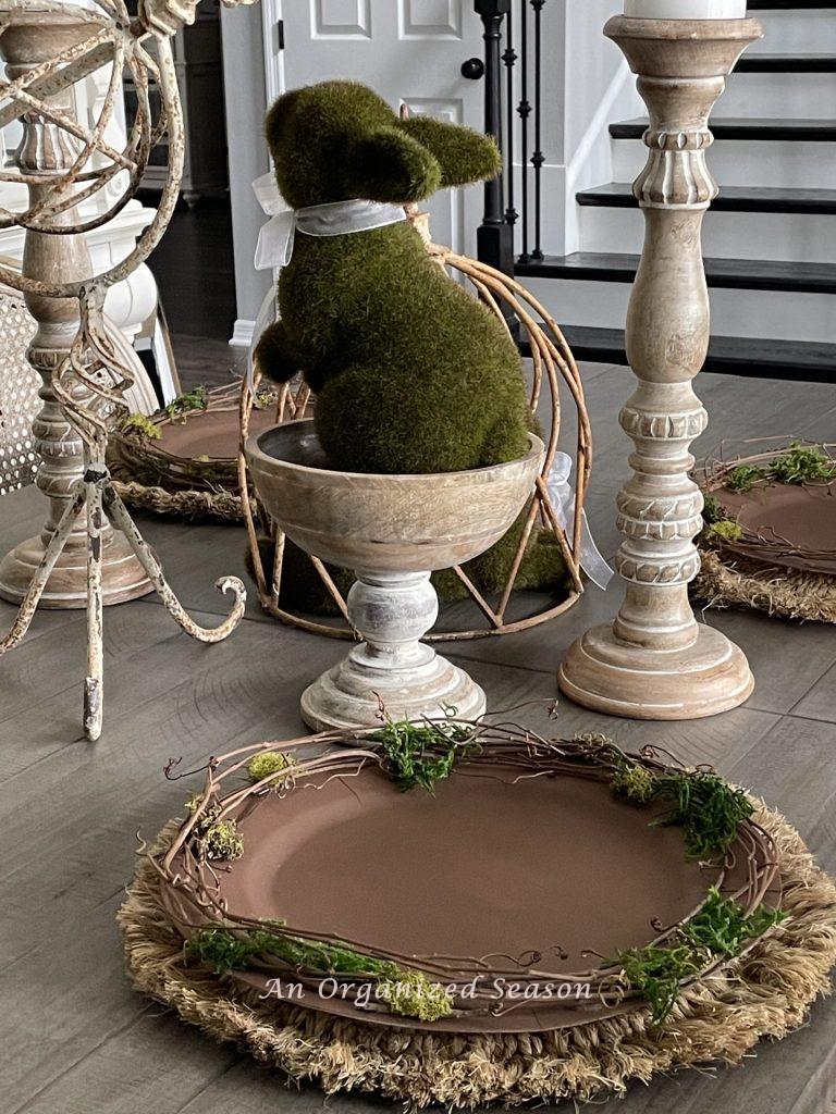 Chargers made of twigs and moss add interest in this nature-inspired Easter tablescape.