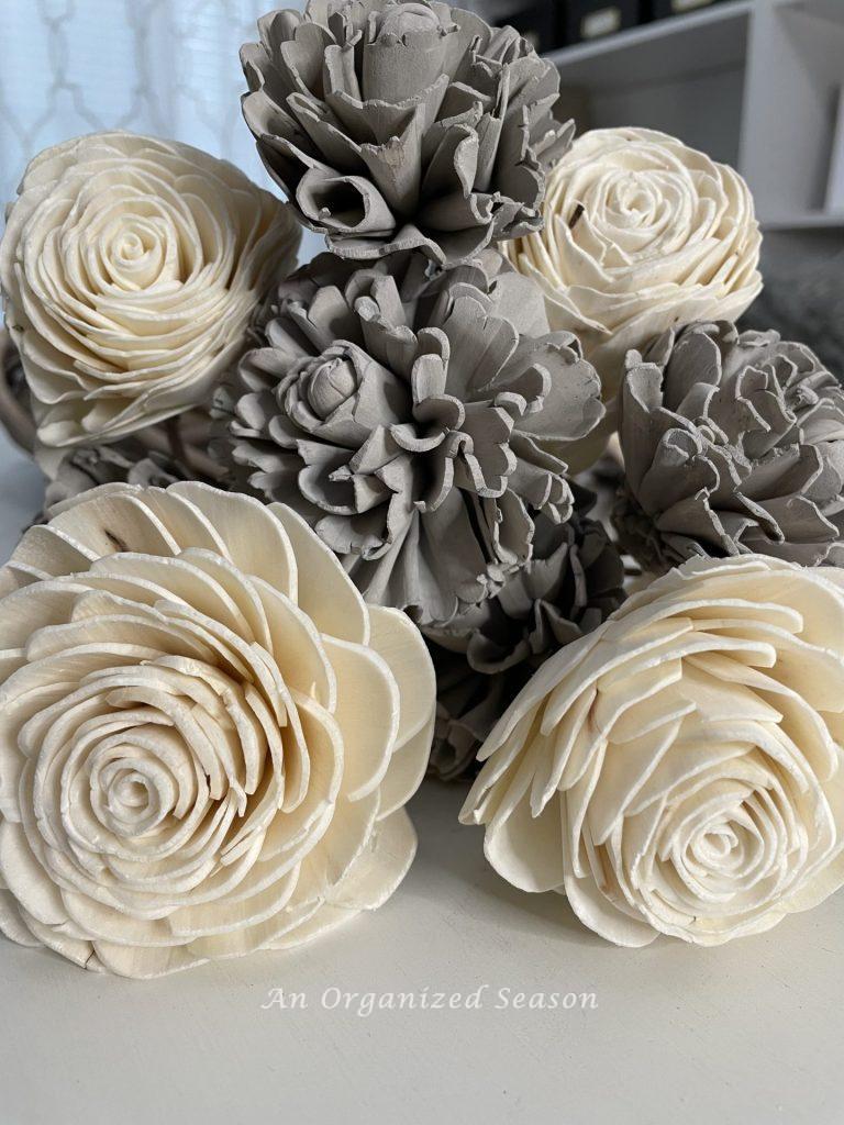 Gray and white Sola flowers used to create a wood flower wreath.