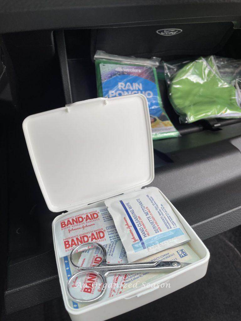 A small first aid kit in car glove compartment is a  strategy to clean and organize a car.