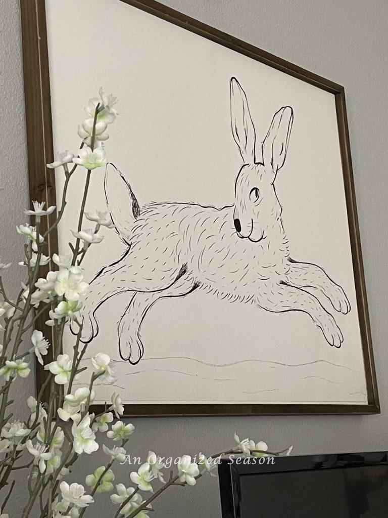 Black and white original artwork of a bunny hopping, an idea to decorate your home for Spring.