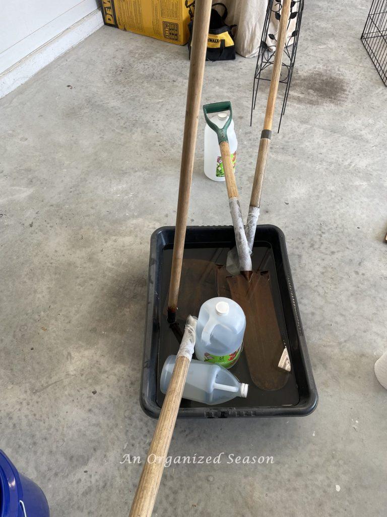Submerge shovels in vinegar is step five to learn how to maintain and organize your yard tools.