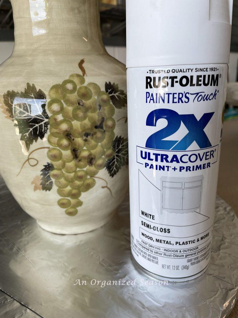 A pitcher and can of Rustoleum spray paint used to transform old ceramic items with spray paint!