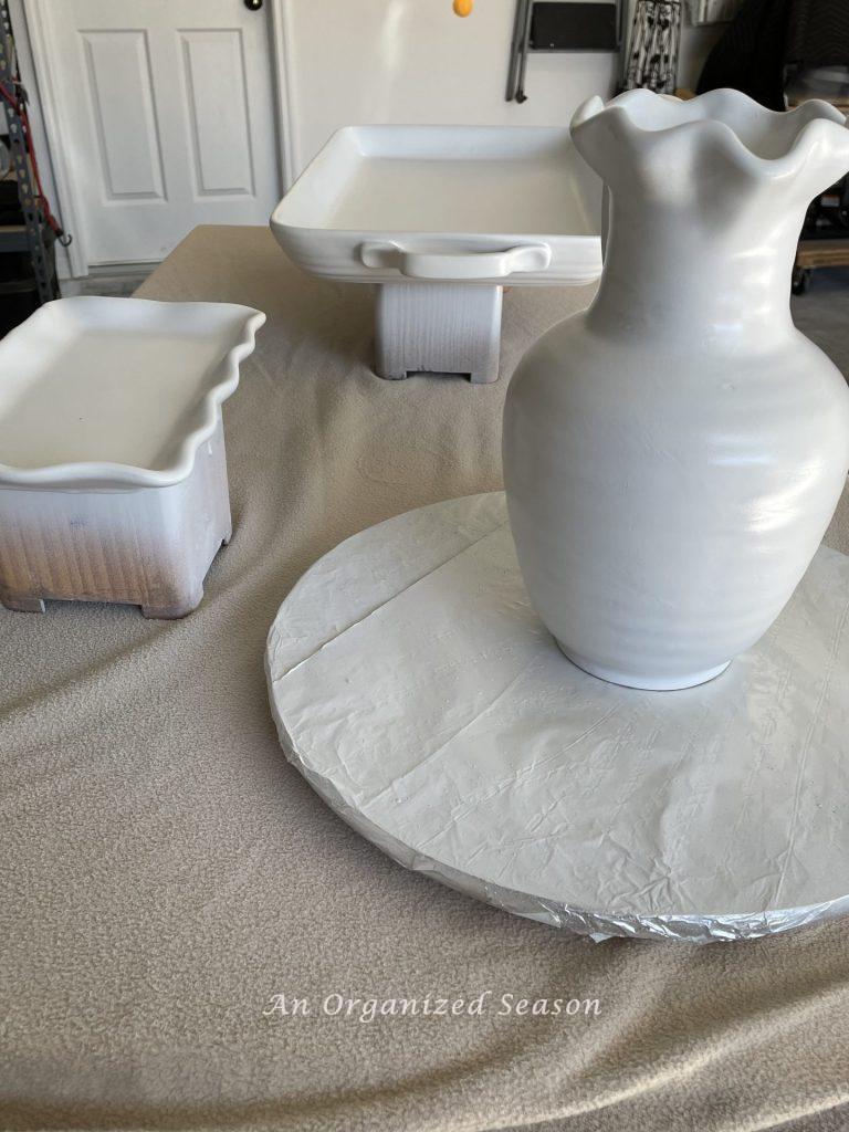 Decor items after three coats of paint showing how transform ceramic items with spray paint!