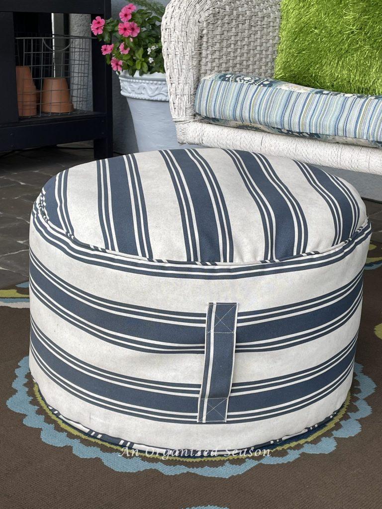 There are15 items you need to create a relaxing porch, adding a pouf is number six.