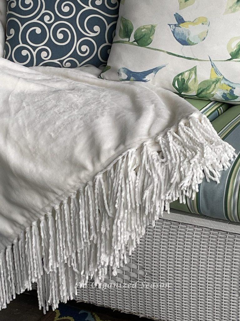 There are15 items you need to create a relaxing porch, adding a throw blanket is number seven.