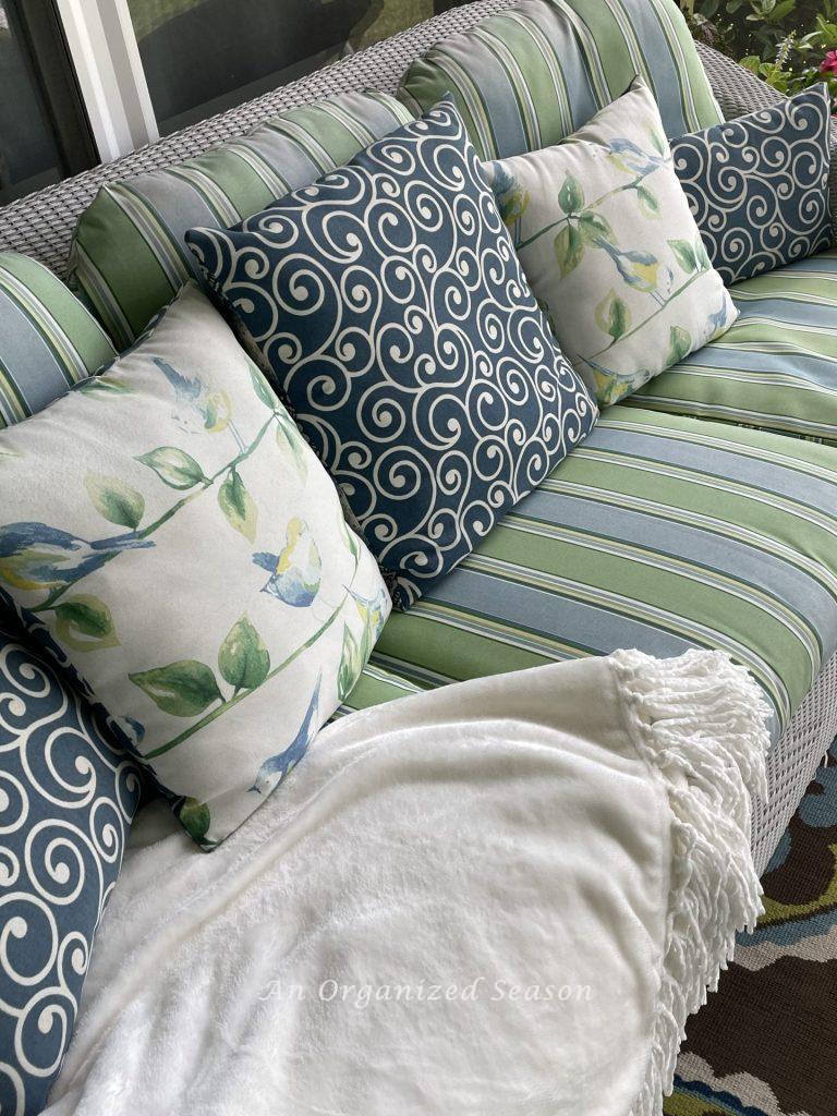 There are15 items you need to create a relaxing porch, adding throw pillows to a couch is number three.